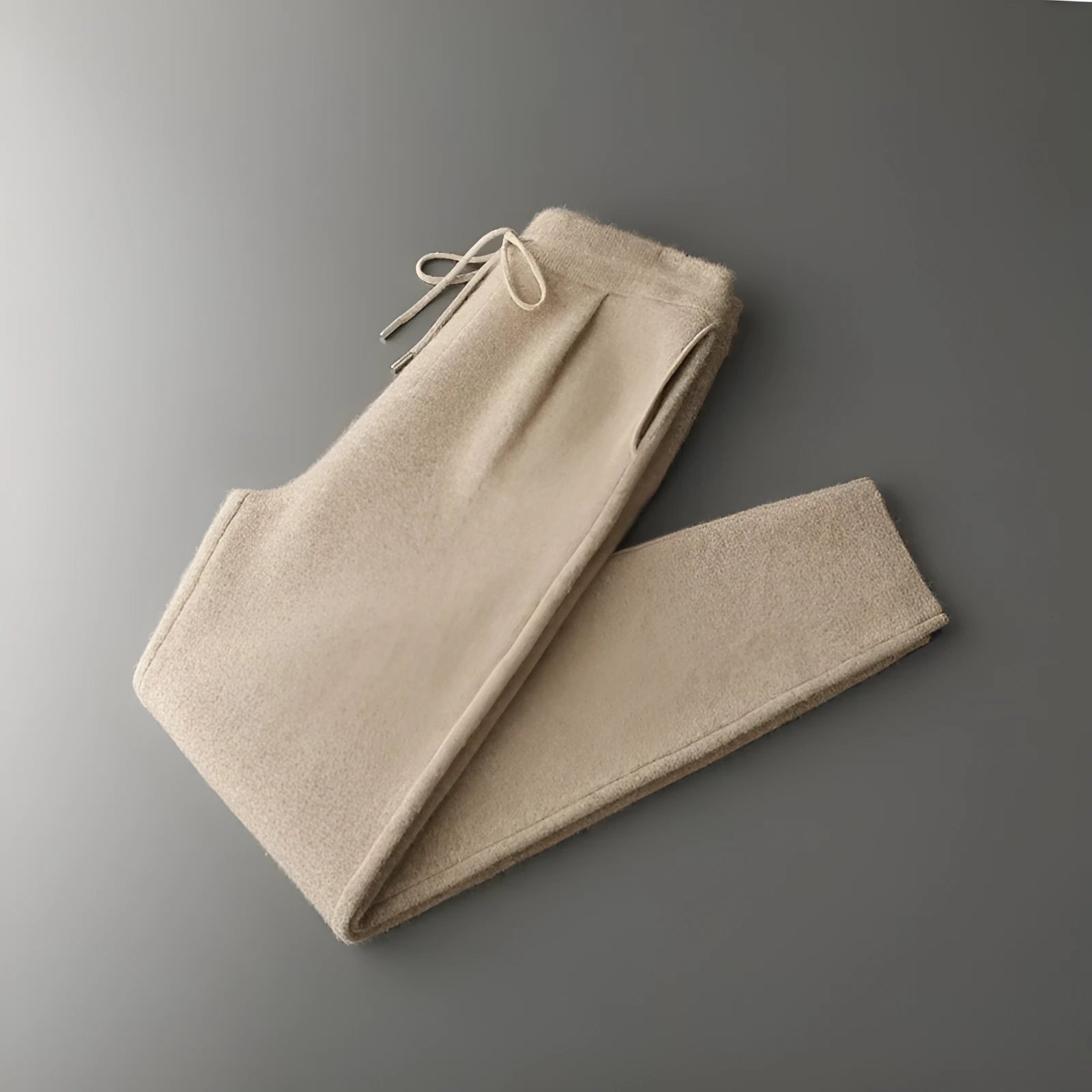 Men's loose cashmere trousers in light camel colour; winter casual wear with elastic waist