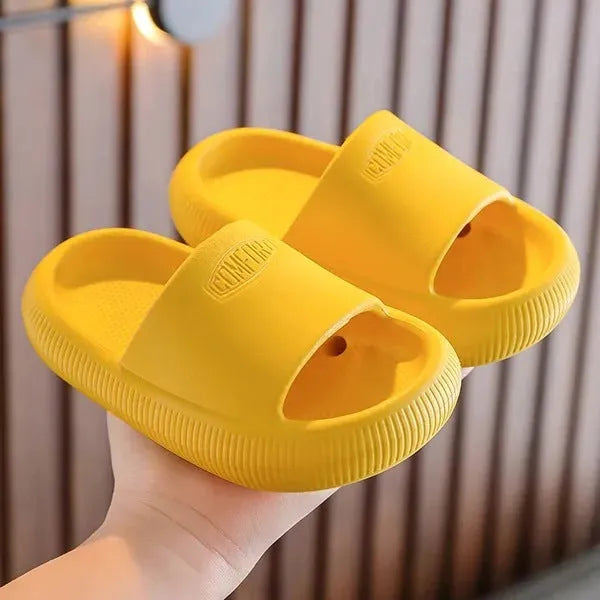 Children's colourful EVA slippers with a textured non-slip sole, shown in a mixed colour selection.