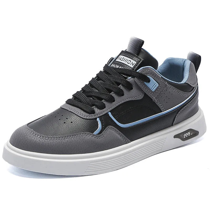 Men's low-top canvas board shoes in grey with leather stitching detail on a white background.