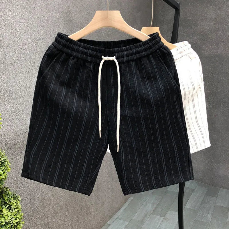 Black and white striped men's casual fleece-lined shorts with an elastic waistband.