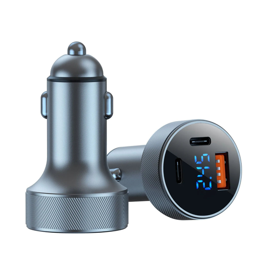 Black aluminium alloy car charger with digital display plugged into a vehicle cigarette lighter.