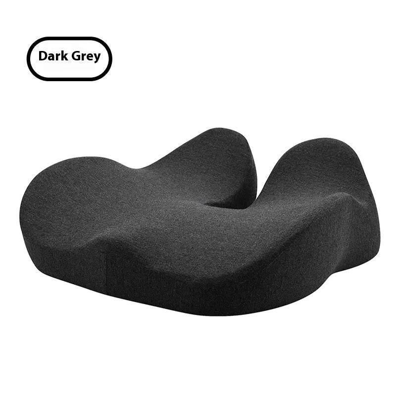 Solid-colour memory foam office chair cushion in light grey, shown on a chair.