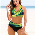 A striped tie-dye ladies bikini set with a backless top and high-waisted briefs on a mannequin.