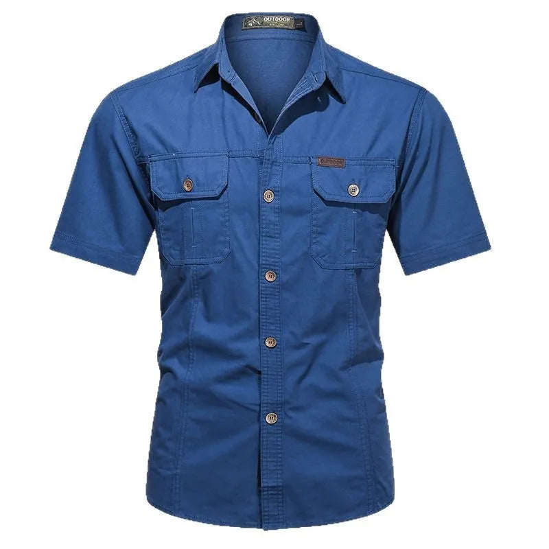 Man wearing a beige cotton short sleeve work shirt with a cardigan style and loose fit.