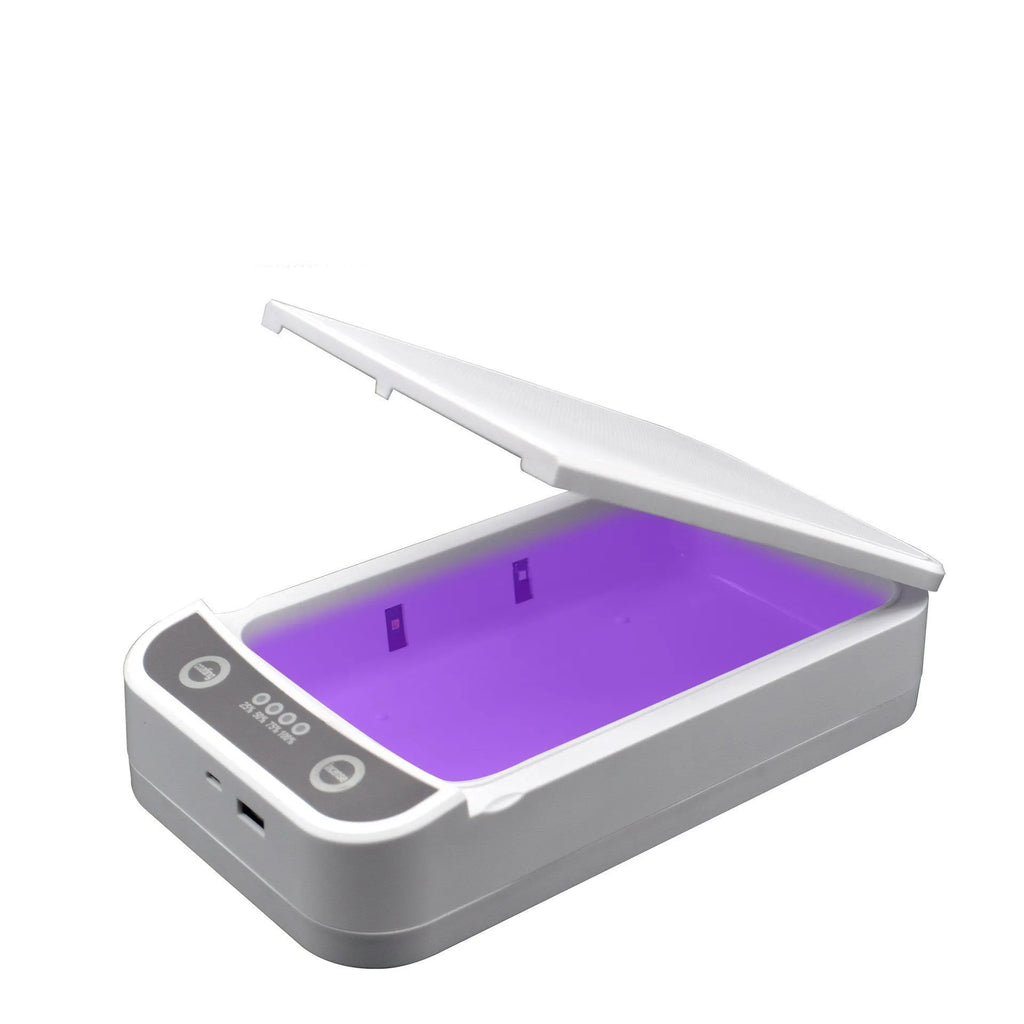 Compact white UV disinfection box with closed lid, showing scale next to a mobile phone.