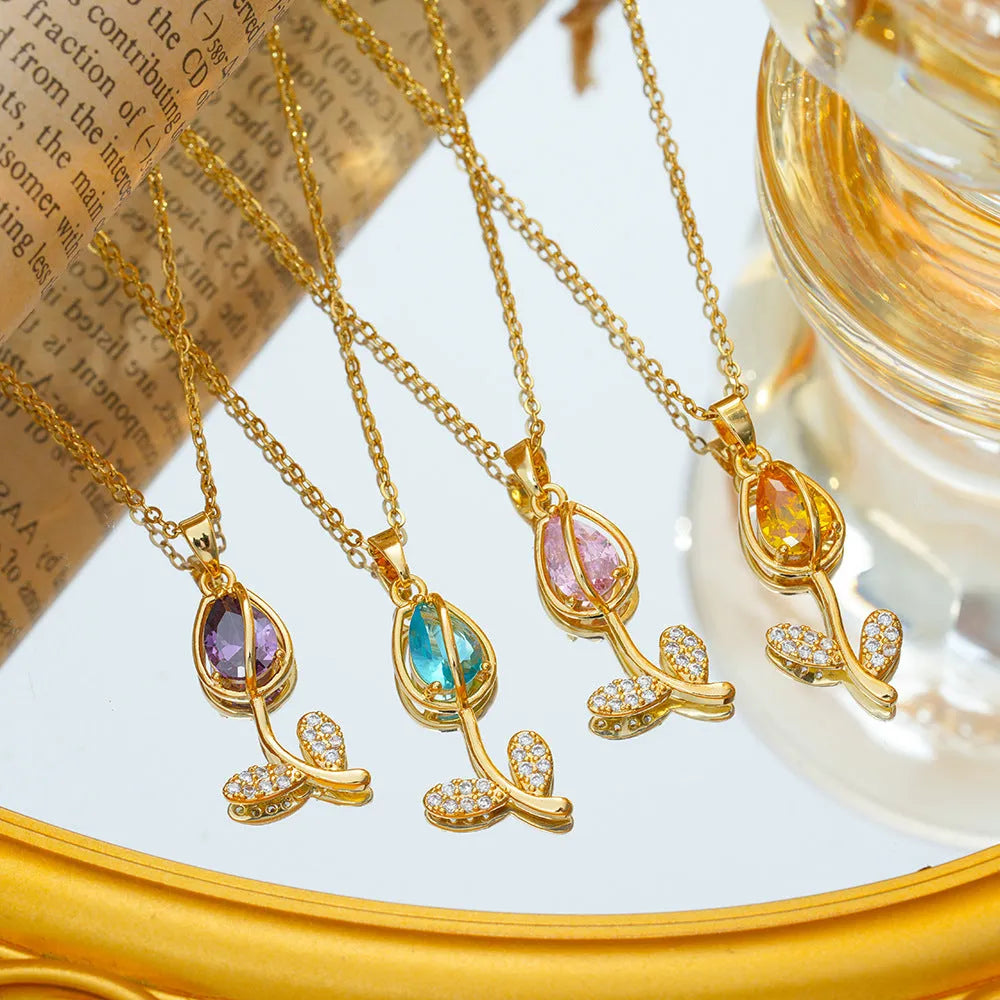 Zircon Tulip necklace with gold floral pendant on an adjustable titanium steel O-ring chain.