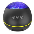 Coversage ocean wave projector LED night light with Bluetooth speaker in black, showing wave projection on wall
