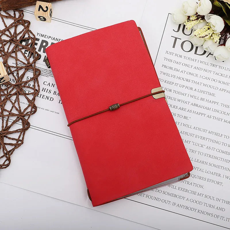 A6 notebook with imitation leather cover in grey, pink or red colours showing cowhide rope binding