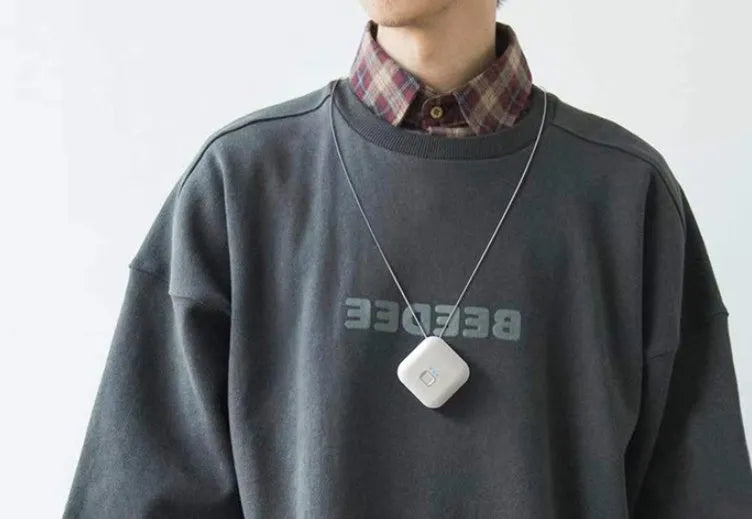 USB mini portable air purifier necklace in blue, grey, pink or white colours with charging cable