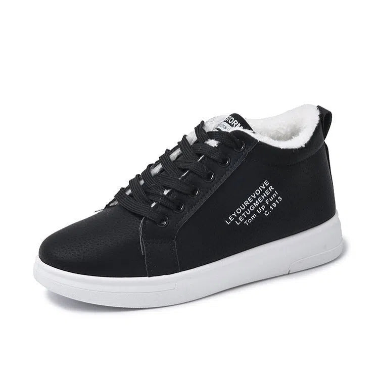 Women's flat sneakers with round toe and front lacing in black, brown, white, and pink