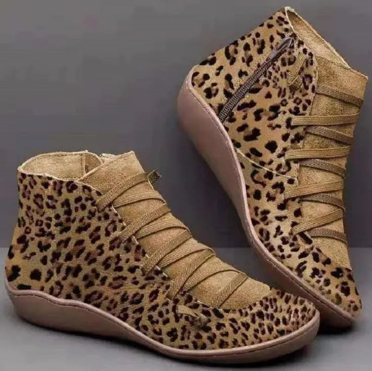 Women's casual flat ankle boots in artificial PU leather with a round toe and wedge rubber sole.