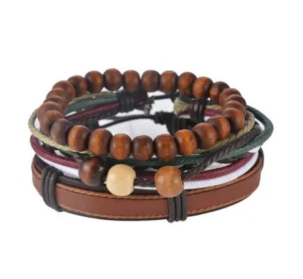 Handmade brown leather wrap bracelet with wooden beads and braided cord on a wrist.