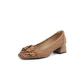 Women's light brown leather pumps with hollow weave design showing cooling openings and mid heel