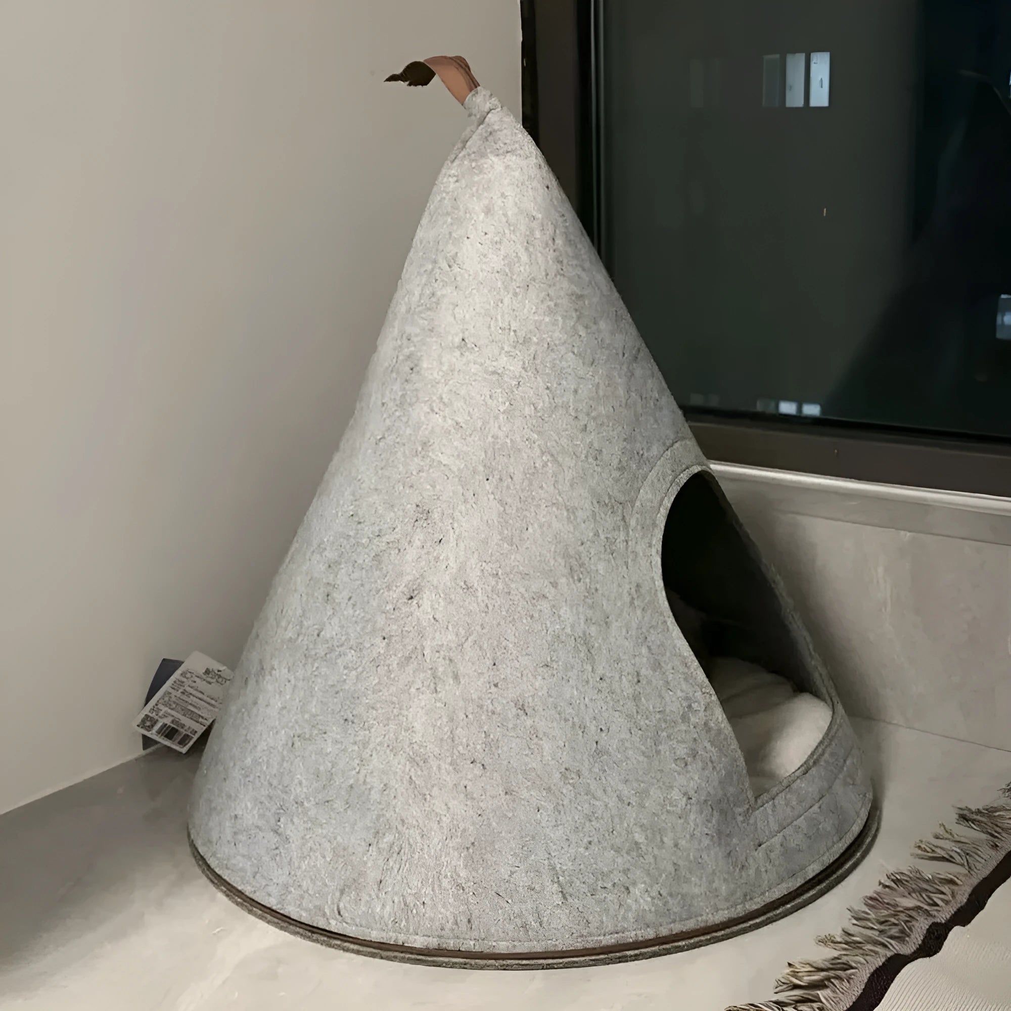 Grey handmade felt cone-shaped cat house with Christmas theme, showing enclosed tent-style design.