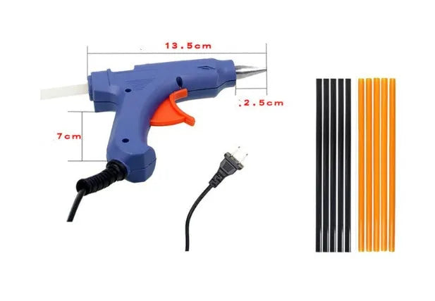 White automotive dent repair kit with five approach bridges and 20W glue gun on workshop bench