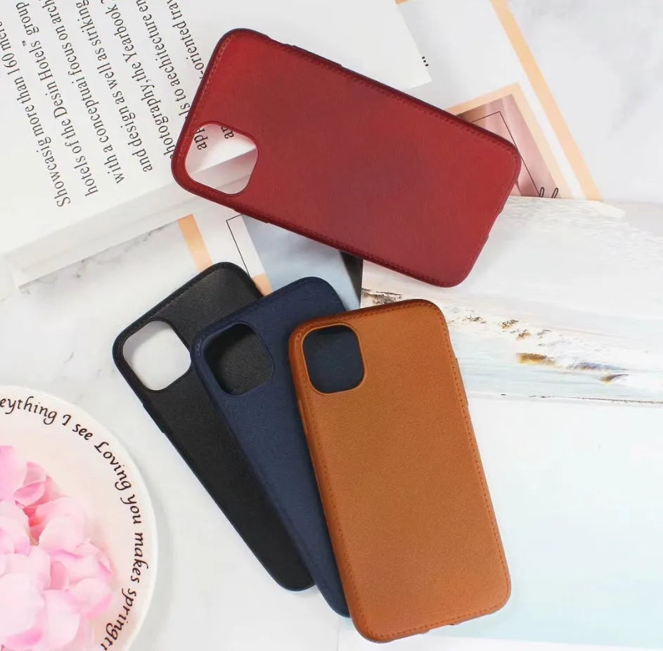 Genuine leather phone case for Apple iPhone in black, shown fitted to an iPhone 11 model.