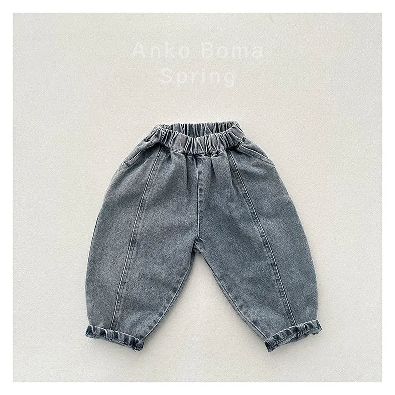 Light blue children's baggy denim jeans with elastic waistband, front view