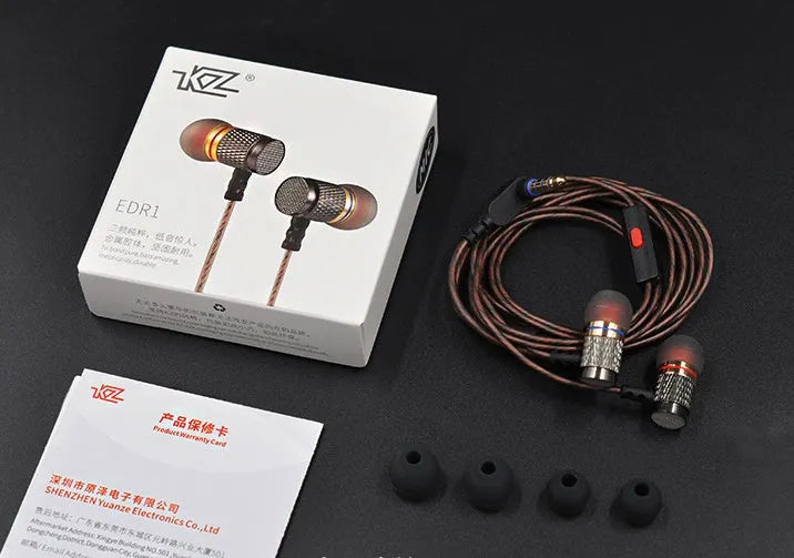 Black wired in-ear headphones with 3.5mm L-bend plug and silicone cable, showing TPE earplugs.