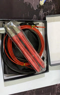Sports skipping rope with aluminium alloy handles and black wire PVC rope on a smooth floor