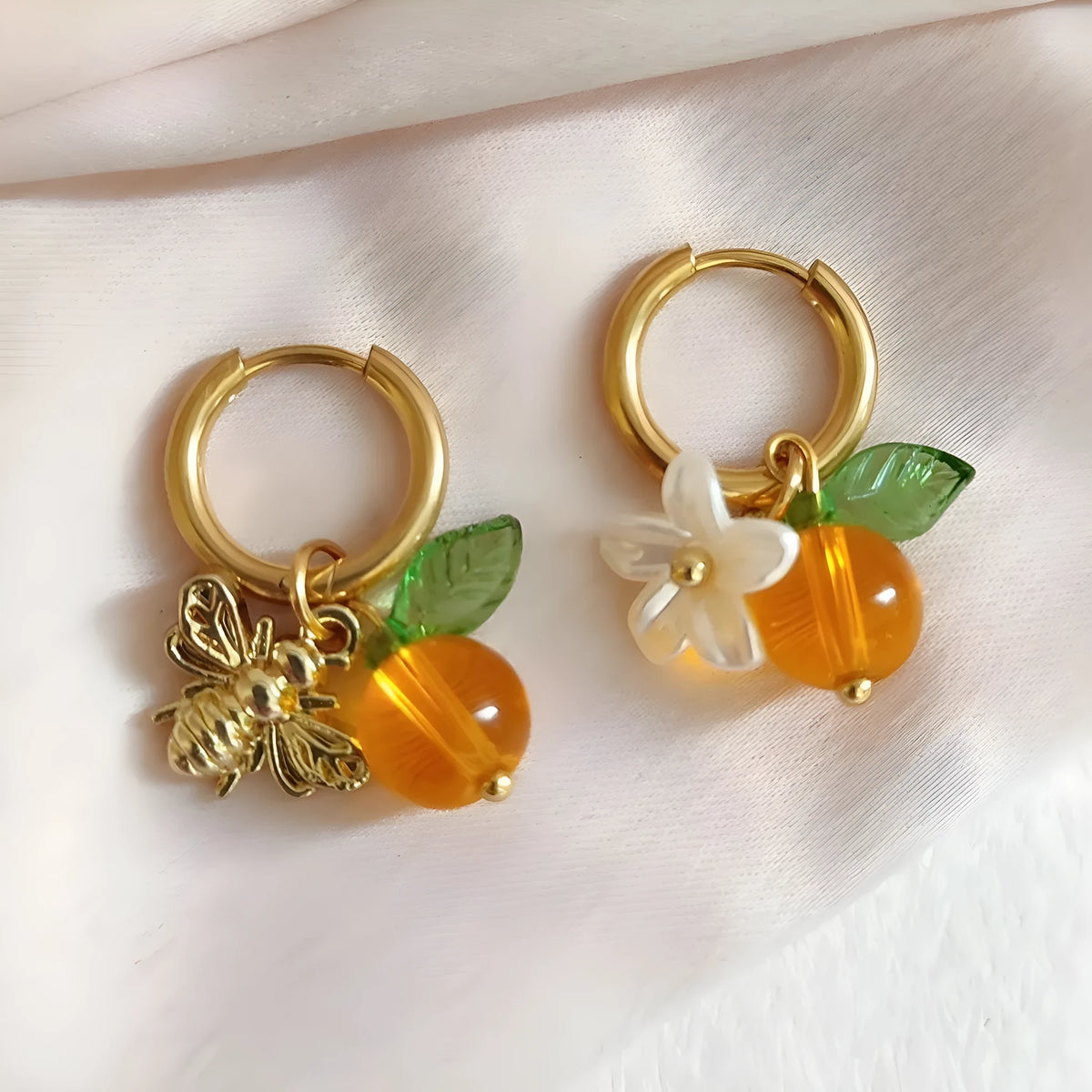 Yellow acrylic bee shaped earrings for women with honey fruit design and electroplated finish, Korean style pair