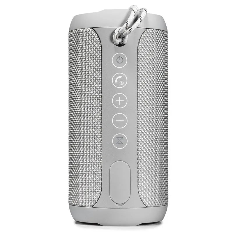 Black outdoor waterproof Bluetooth speaker with control buttons, shown in a garden setting.