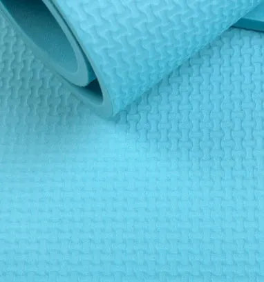 EVA fitness yoga mat in blue, showing non-slip texture and 4mm thickness.