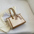 Soft PU leather commuter tote bag showing open outer pockets and horizontal square design