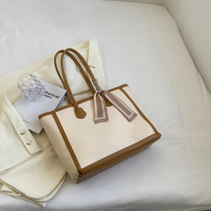 Soft PU leather commuter tote bag showing open outer pockets and horizontal square design