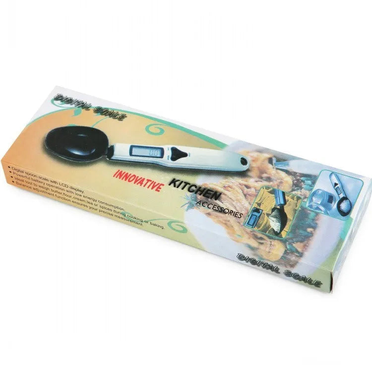 Digital measuring spoon with electronic display showing weight measurement in grams