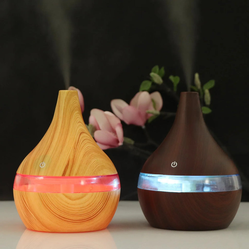 Columnar USB mini air purifier and humidifier in wood grain finish on a desk