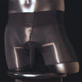 Men's shiny transparent underpants in black on a mid-waist model, showing U-shape style.