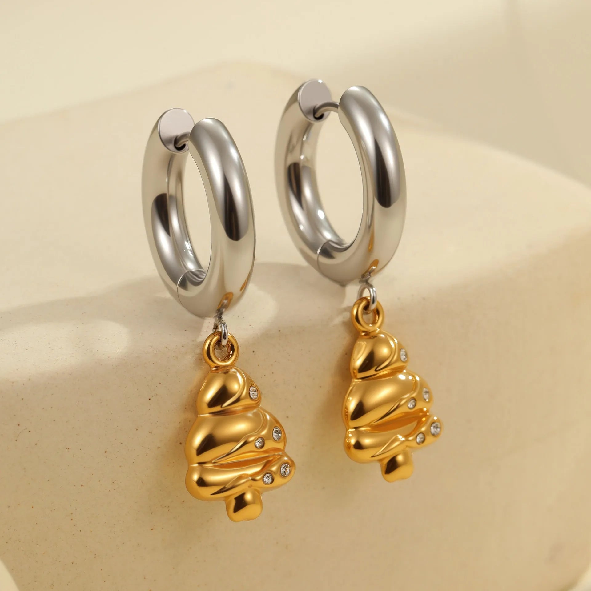 Stainless steel Christmas tree heart earrings with electroplated 18K gold finish showing heart and star shapes