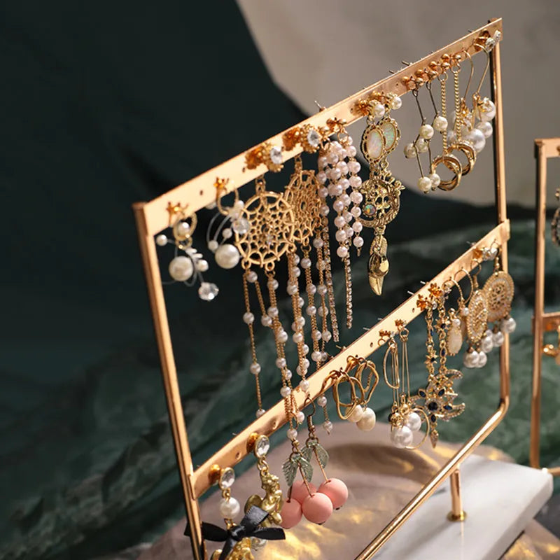 Alloy earring storage rack in green or white for organising earrings on a dressing table or shelf