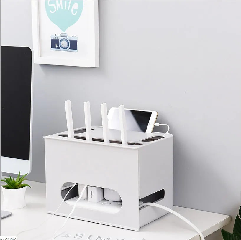 A grey and a white plastic router storage box for organising Wi-Fi routers and network cables.