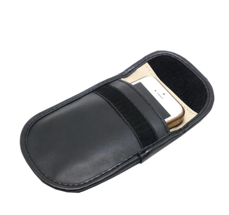 Black microfiber Faraday cage pouch for car key fob and RFID card protection.