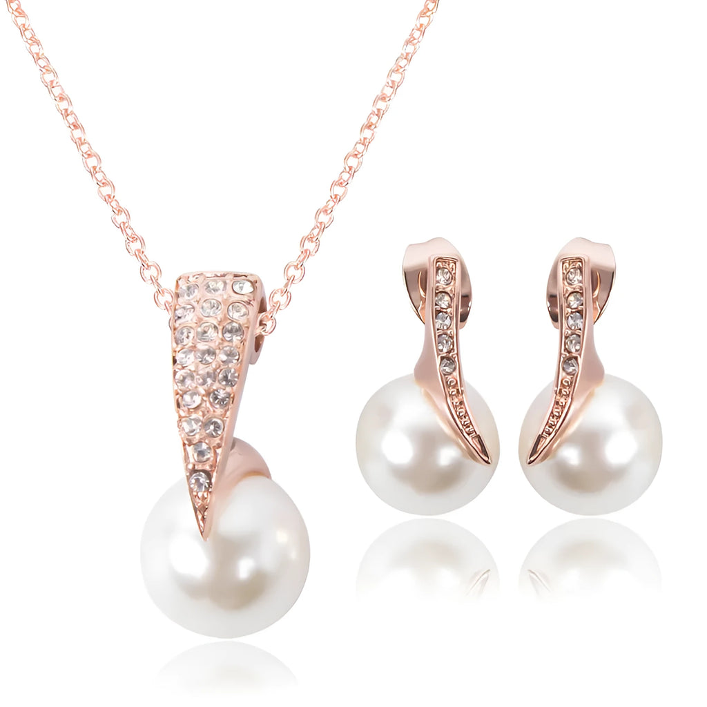 Rose gold alloy bridal necklace and earrings set with pearl inlay and mother-of-pearl pendant on water wave chain