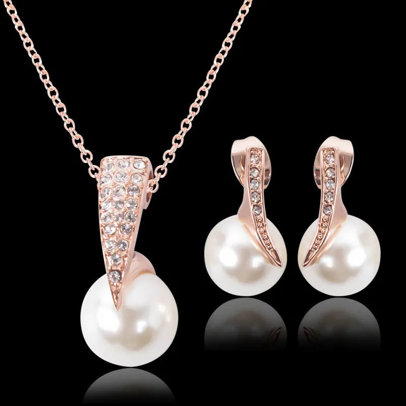 Rose gold alloy bridal necklace and earrings set with pearl inlay and mother-of-pearl pendant on water wave chain