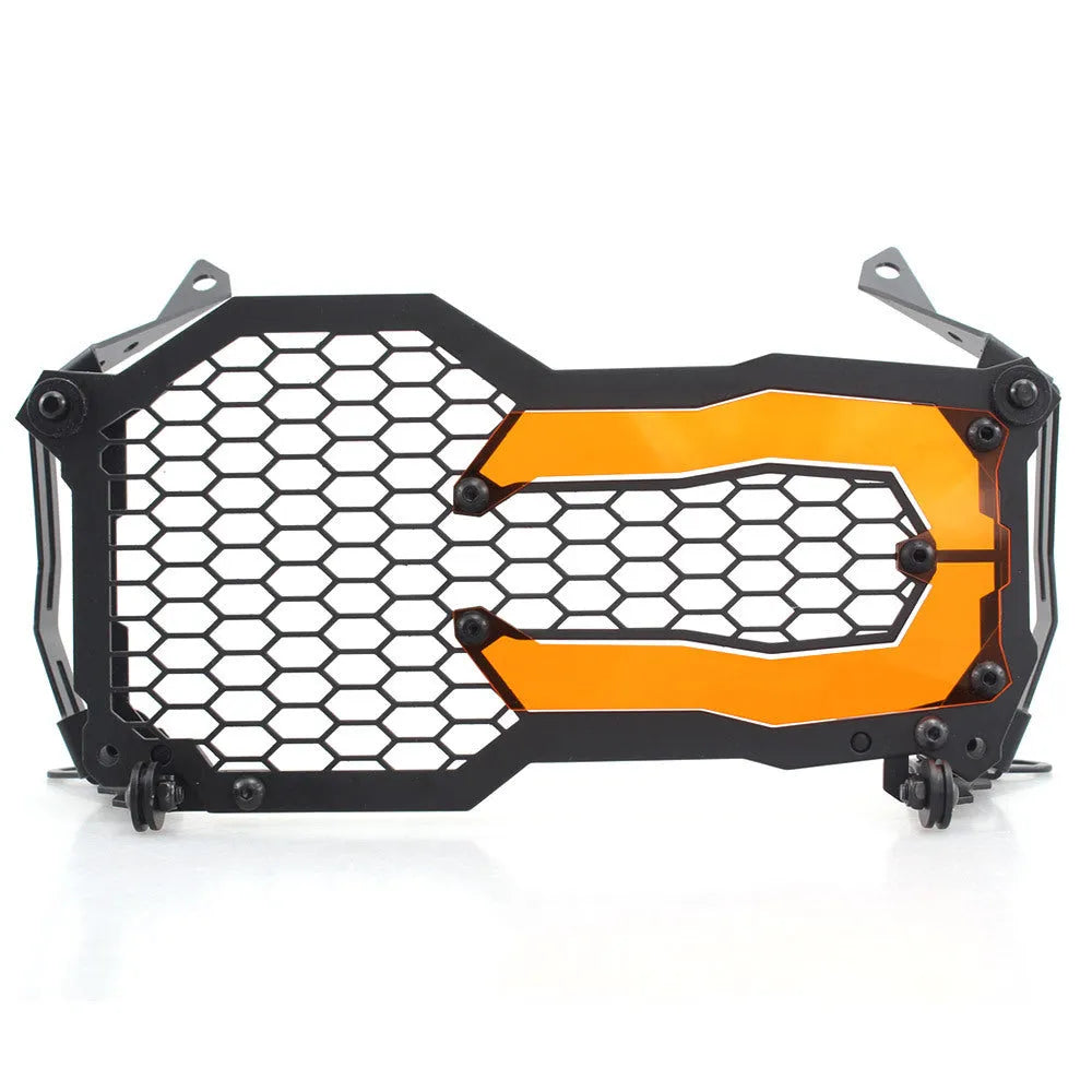 BMW motorcycle headlight protective cover in fluorescent yellow mounted on a GS adventure bike.