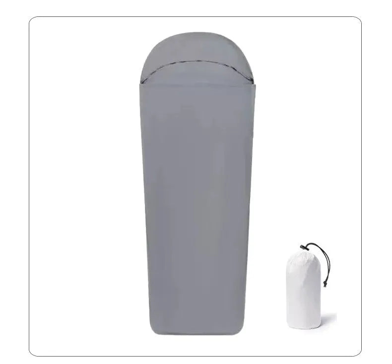 Blue mummy-style camping sleeping bag with tapered design on a green background.