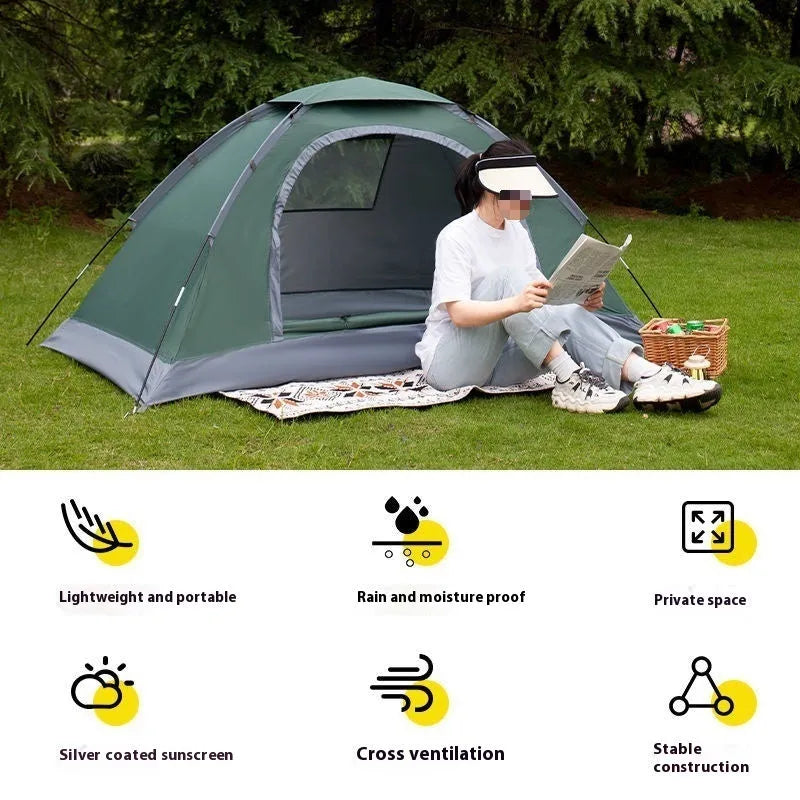Single person portable camping tent in green, shown unfolded with fibreglass pole.
