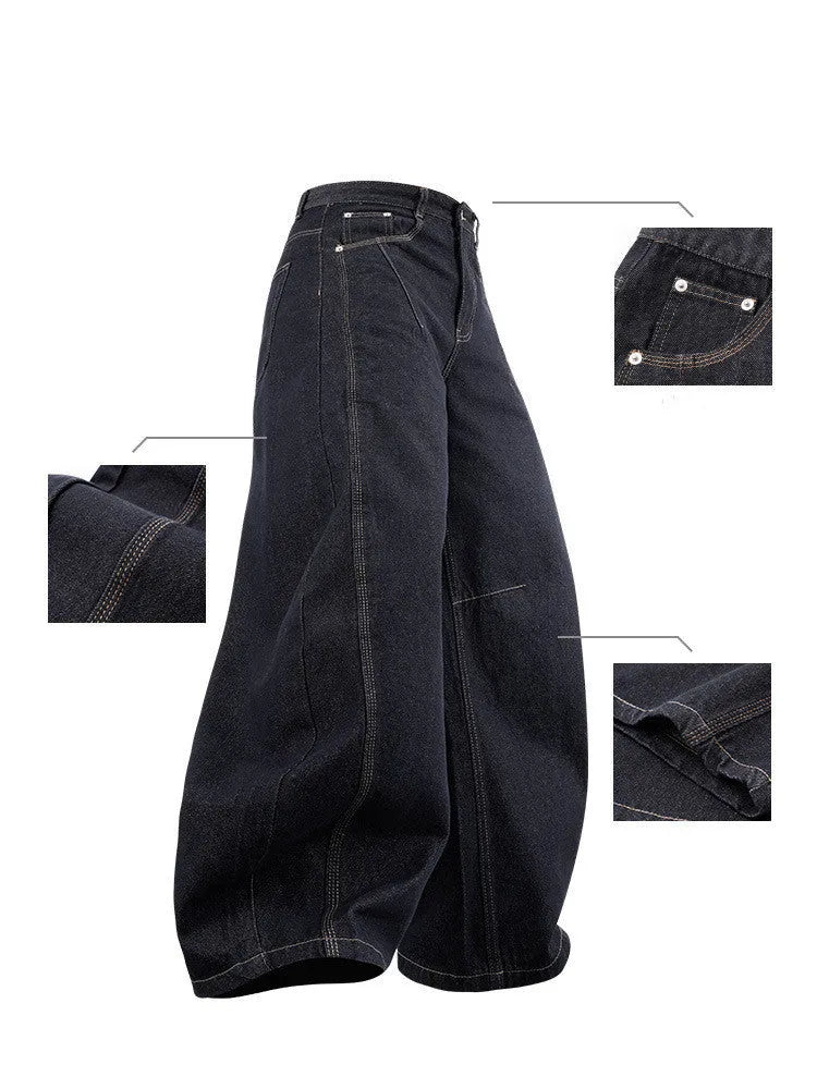 Men's wide leg denim trousers in original cow colour, laid flat to show mid-waist and relaxed fit.