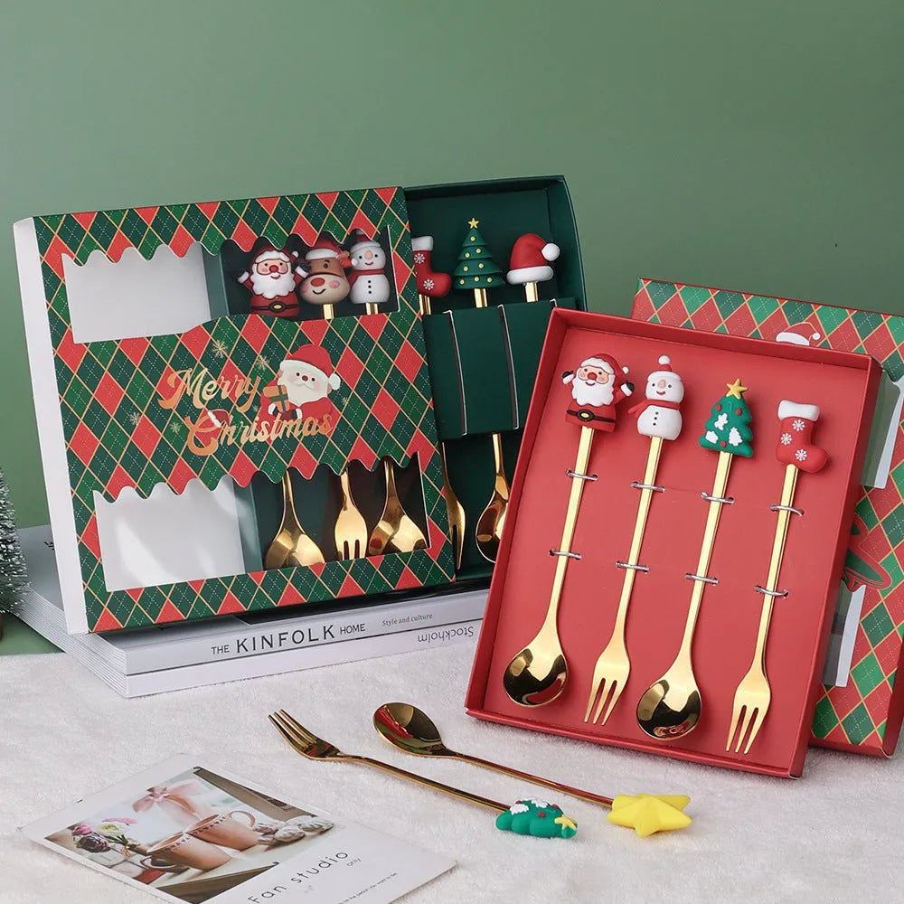 Red stainless steel Christmas spoon and fork set with tree and snowman patterns on handles