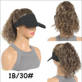 Short synthetic wig with horse tail waves style on a nude hat base, shown in a dark brown colour.