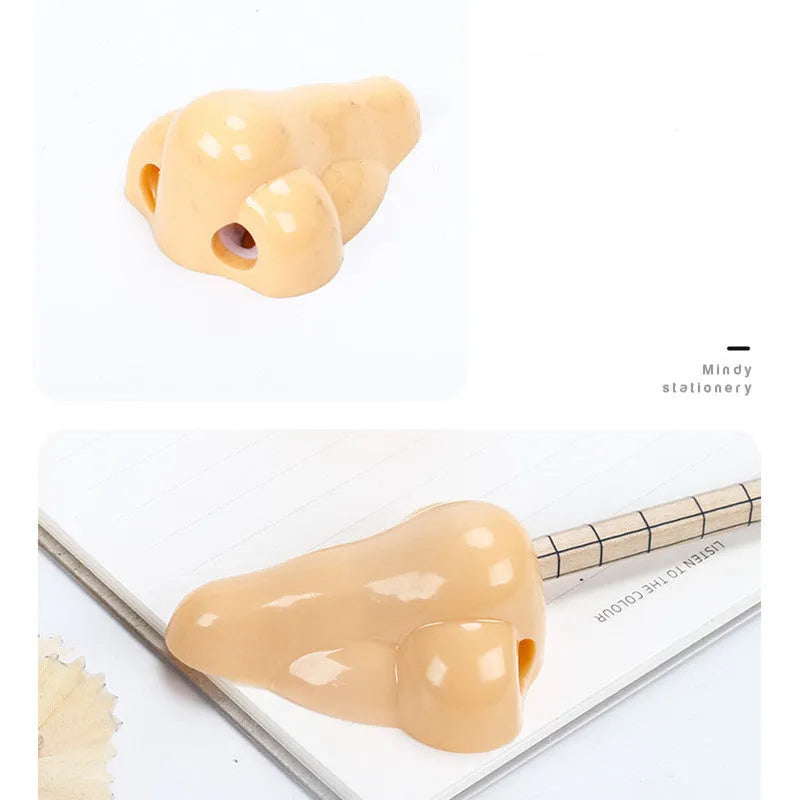 Flesh colour plastic manual pencil sharpener with big nostril, showing geometry shape.
