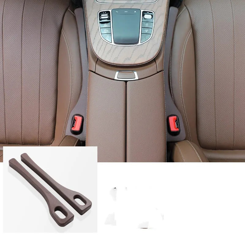 Two polyresin car seat gap sealing strips in chosen colour, shown next to a vehicle seat.