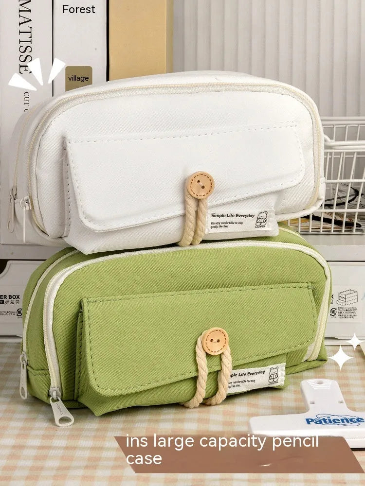 Green Korean style canvas pencil case open showing pen storage capacity