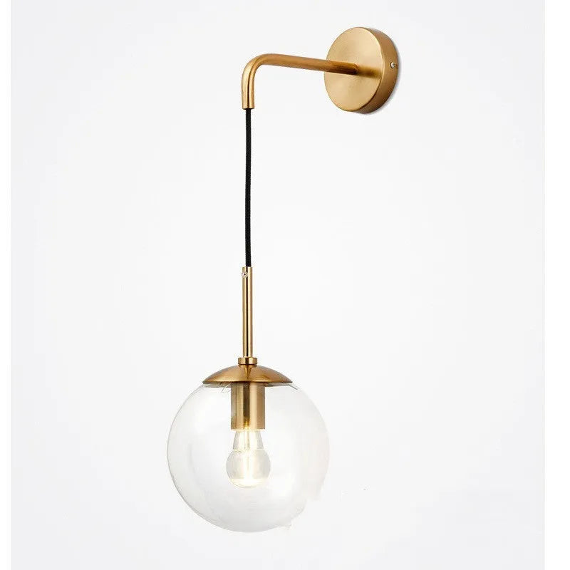 Nordic glass wall lamp with amber glass shade, black metal body, mounted on wall