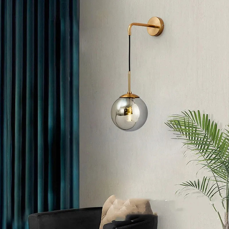 Nordic glass wall lamp with amber glass shade, black metal body, mounted on wall