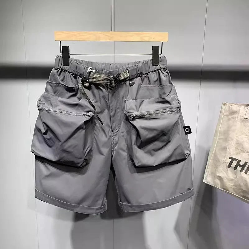 Large size men's work shorts in black with multiple pockets and straight leg design