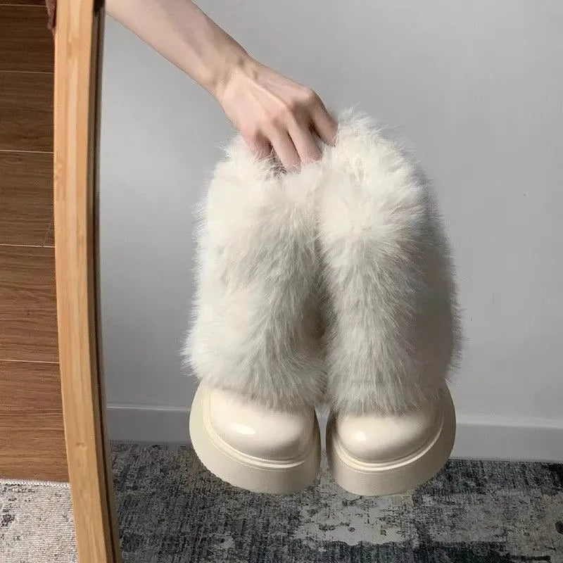 Women's black artificial plush snow boots with a waterproof rubber sole and round toe design.